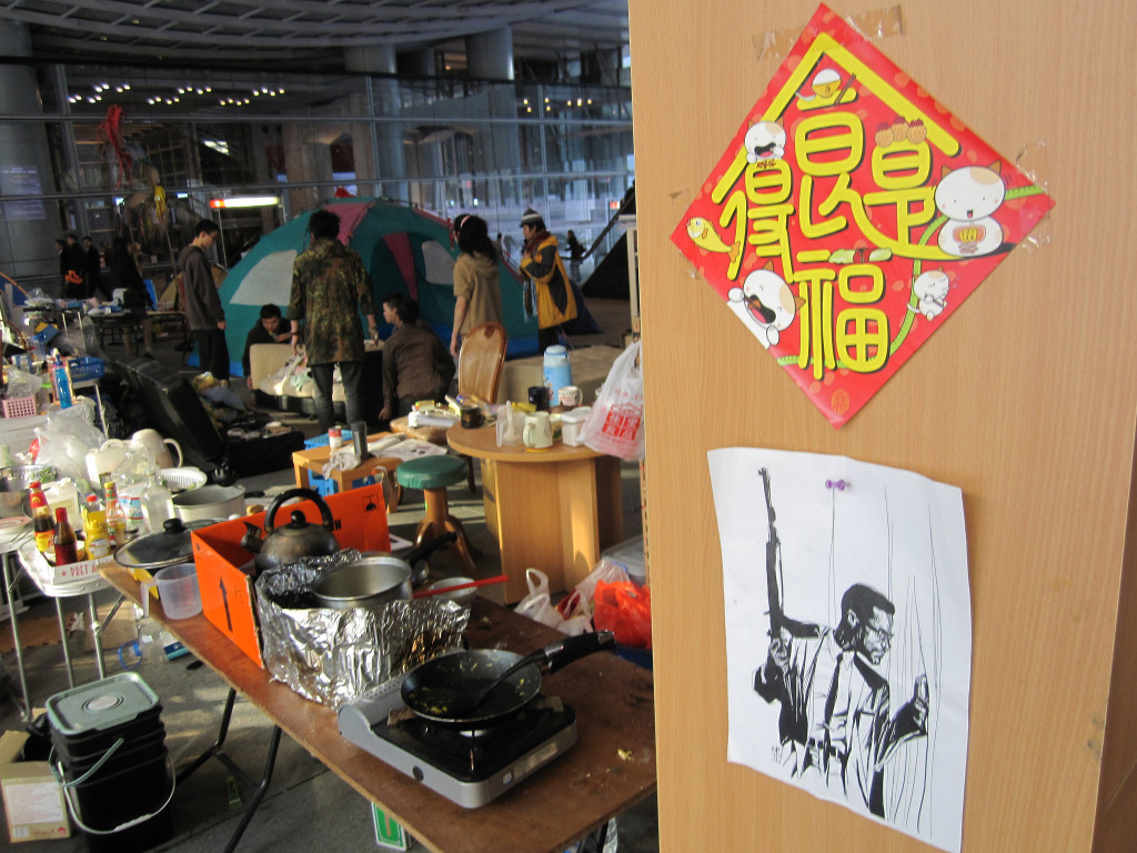 Malcolm X keeps watch over Occupy Hong Kong, aka Occupy Central, under the HSBC building in Central, Hong Kong. Image credit: istolethetv from Hong Kong, China