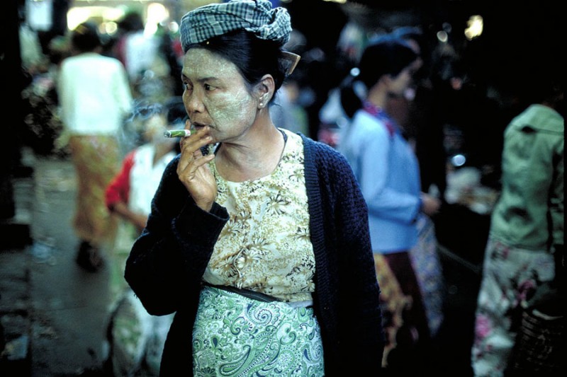 Woman smoking cheroot, Mandalay, 1987. Image Credit: Geoffrey Hiller.