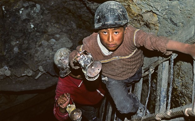 Boys working in the Cerro Rico de Potosi tin mine in Bolivia [Photo: Alamy, The Telegraph]