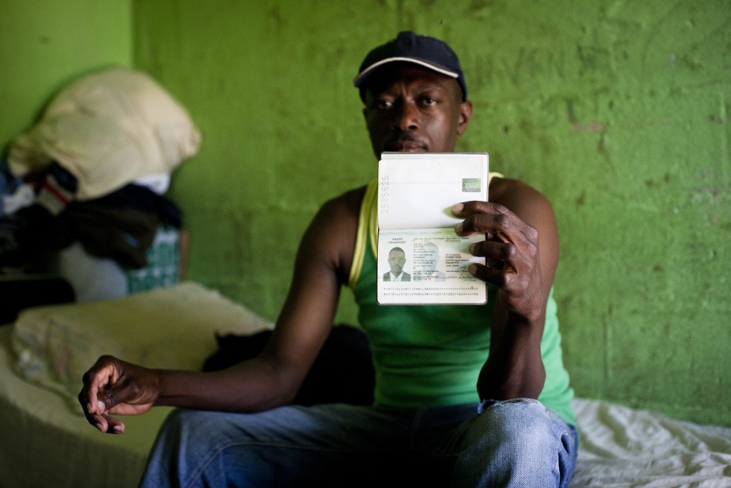 Dominican Republic: Julien Jean Larosse a 42 year old beneficiary of the ASCALA Project. He received his official Haitian Passport in December 2011. Without a passport he described life as being like a 'goat in the mountains'. With a passport, he says that if he dies in the street then at least he can be recognised, identified, he IS someone. Coming from Haiti in the 1990's to work the sugar plantations, he now buys and sells good int he community, However, some weeks ago a thief tried to steal his goods and when he resisted, he was shot twice in the leg. He says he managed ot get to hospital and have the wound treated but as soon as the hospital realised that he did not have official papers they refused to do surgery on the leg, merely removing the billets and dressing the wound. He no walks with a sever limp that will prevent him seeking any employment that requires physical movement or extensive use of his legs. He says he stumbled upon the services of ASCALA 4 years ago when he was starving and in need of food. He was given food and encouraged to apply to apply for a passport on condition that he personally met 50% of the cost of the passport and ASCALA met the remaining 50%. Each passport costs US$80. ASCALA helps Haitians in the community of San Pedro Marcoris obtain official identity papers such as birth certificated and passports (Haitian). UNHCR/Jason Tanner/April 2012 *** Local Caption ***