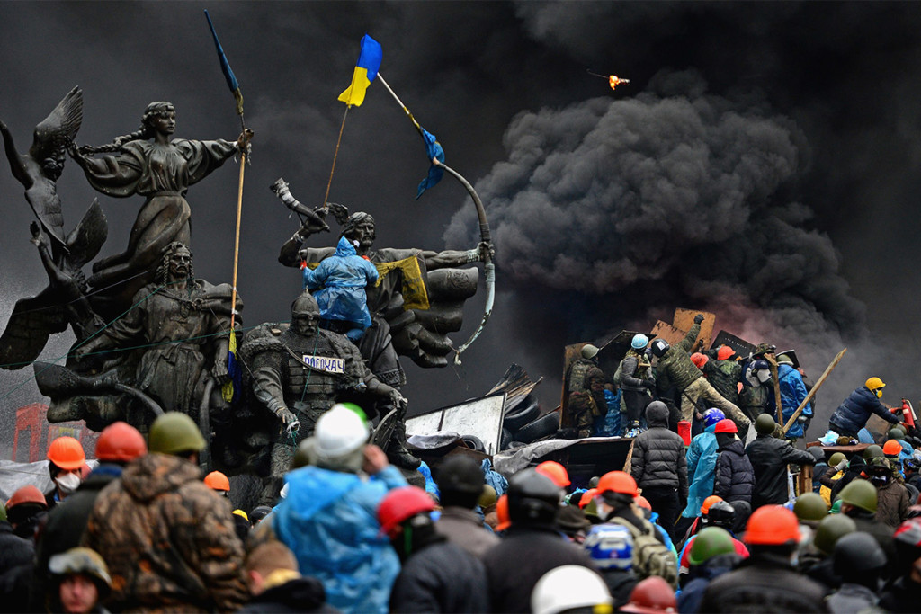 Battles on the streets in Kiev, behind monuments to the city's founders. Image Credit: Getty